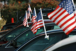 SANTA ROSA, CA - DECEMBER 12:  American flags are seen on cars for sale at Santa Rosa Chevrolet December 12, 2008 in Santa Rosa, California. Auto dealerships continue to see a sharp decline in sales as the Big Three U.S. automakers face possible bankruptcy following a federal bailout that failed to pass through the U.S. Senate.  (Photo by Justin Sullivan/Getty Images)